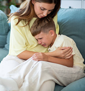 A mother comforting a child.
